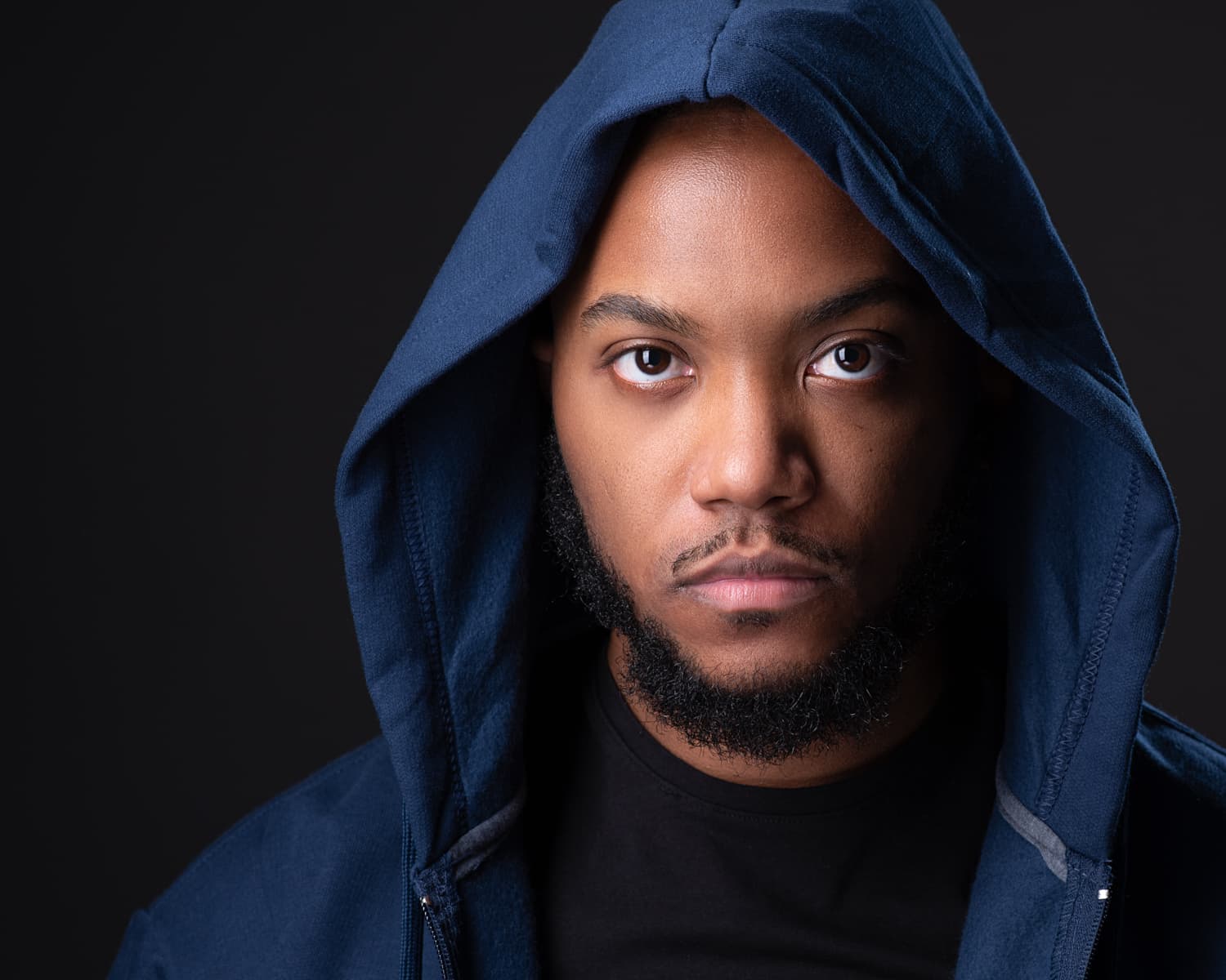 Theatrical actor headshot with dramatic lighting
